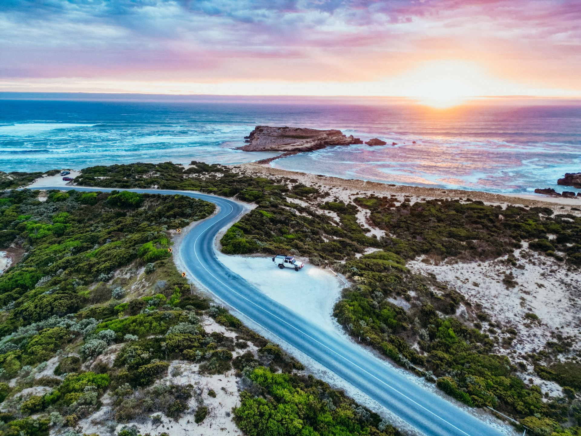 The Feel Good Family travelling a coastal road in South Australia at sunset