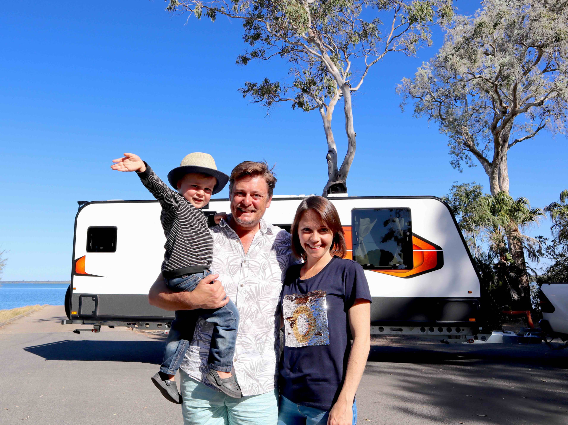 The Feel Good Family towing their caravan on the road