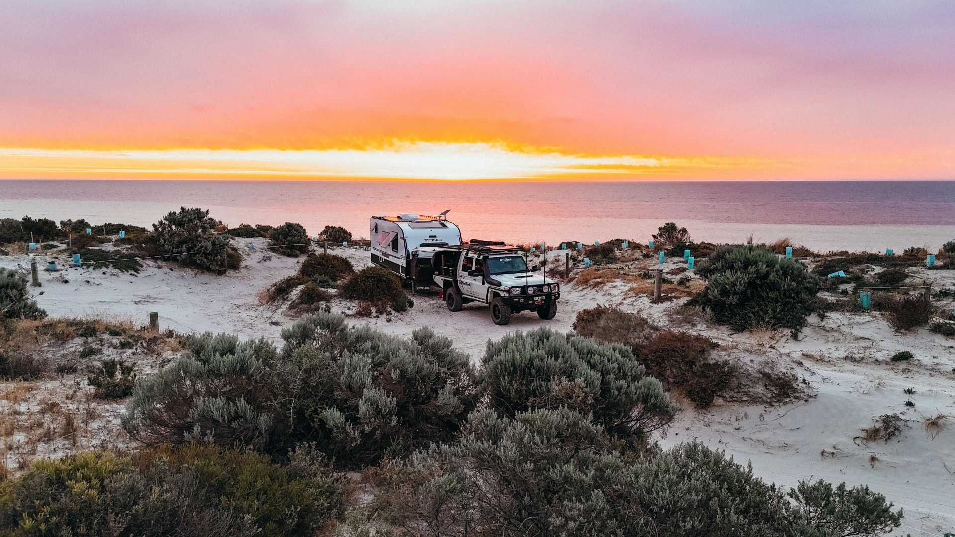 Sunset camp on the South Australian coast with the Feel Good Family caravan