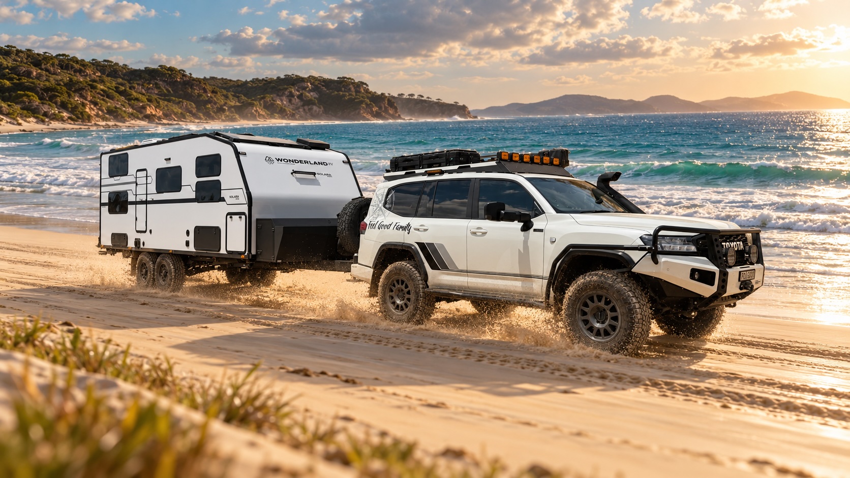 The Feel Good Family 4WD and van driving along the beach at sunset